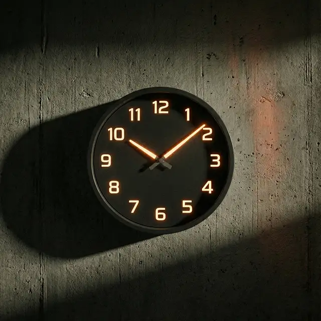 Wall clock with glowing numbers and hands showing time 10:10 with shadow on textured wall.